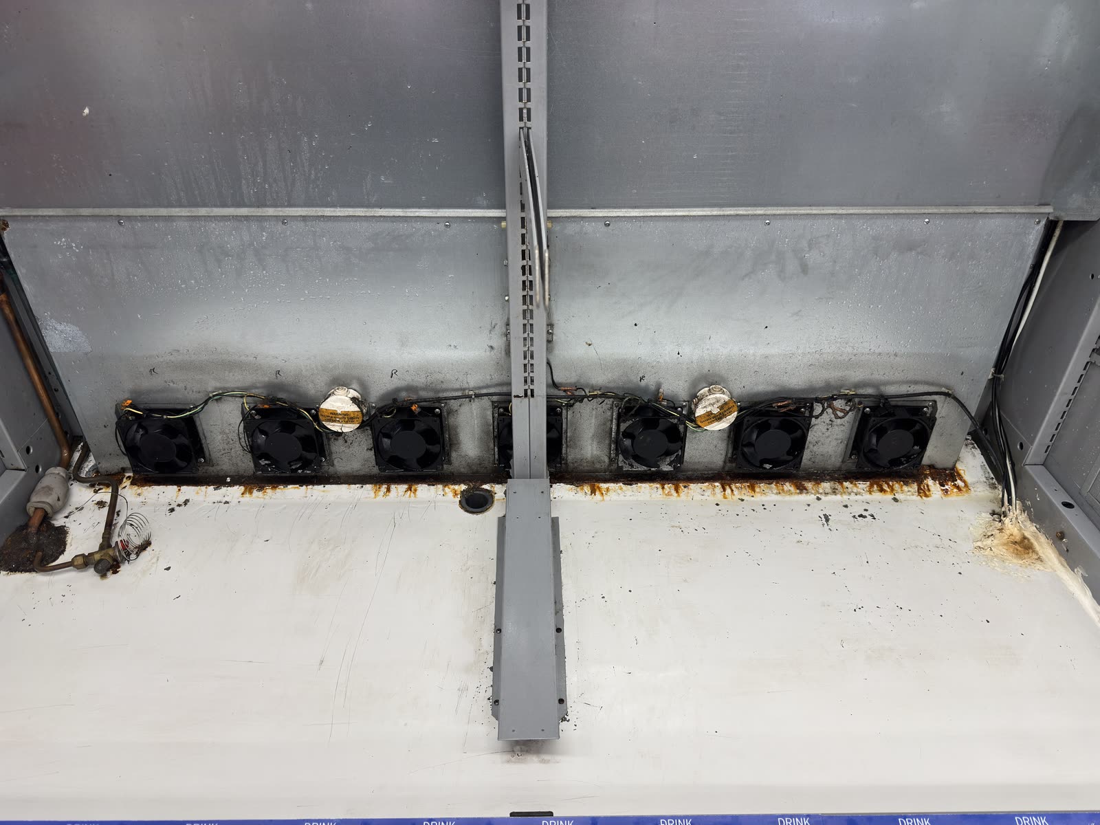 Display fridge fan units — dust, grime and rust cleared — after