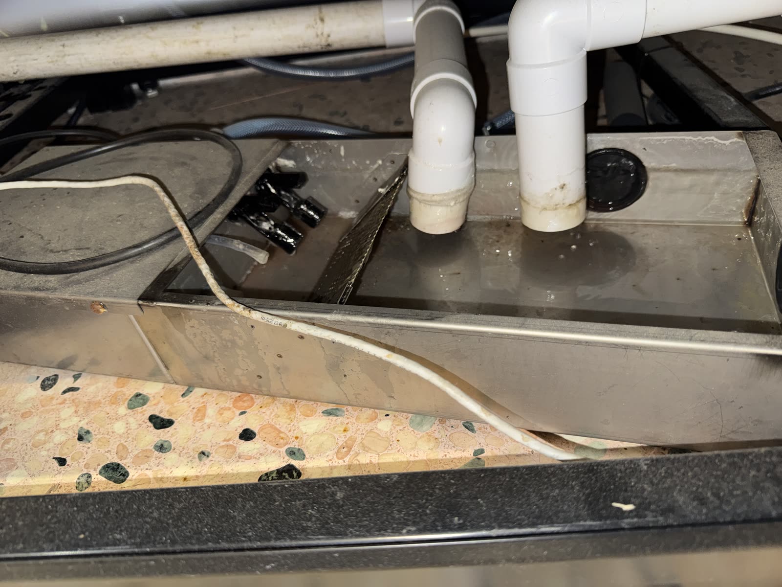 Condensate drain — emptied after clean